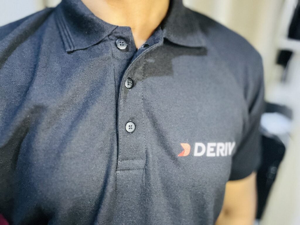 deriv logo on shirt